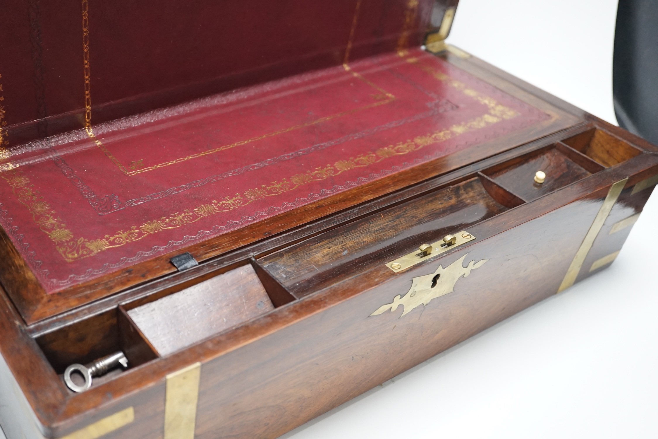 A 19th century brass bound rosewood writing slope, engraved inset to lid. 50cm wide